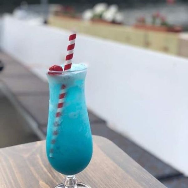 a glass bottle sitting on a table