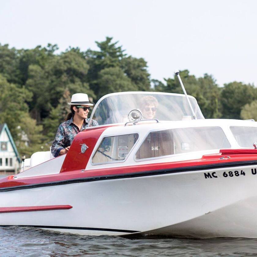 6c58466857848c2e3346db9450c9981a a small boat in a body of water