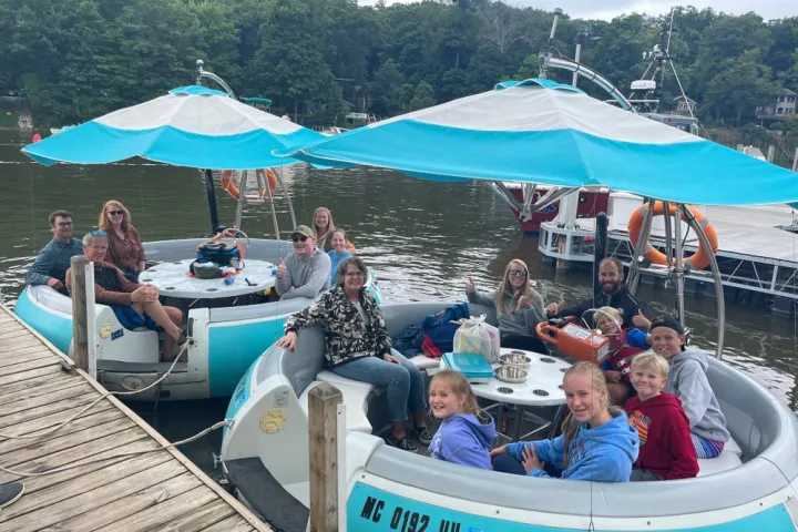 a group of people on a boat in the water