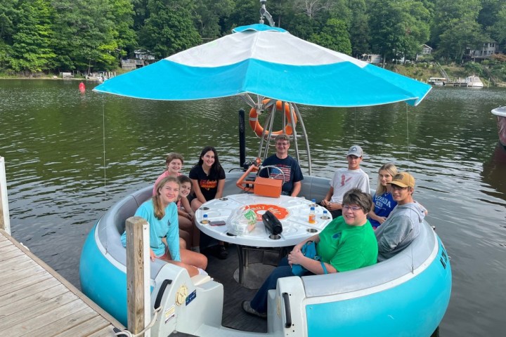 a group of people on a boat in the water