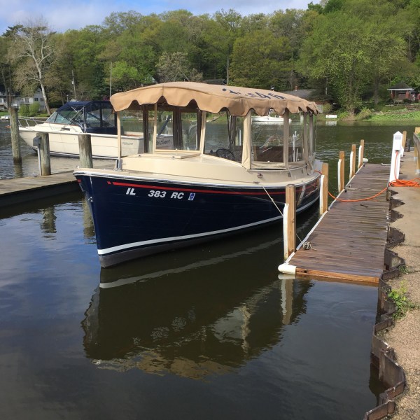 a boat is docked next to a body of water