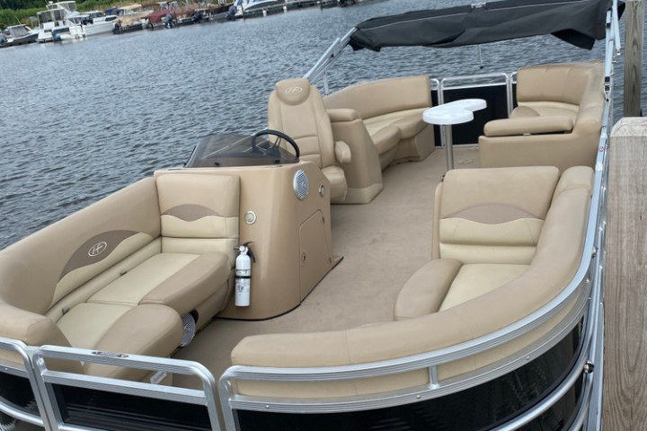 a row of parked motorcycles sitting next to a body of water