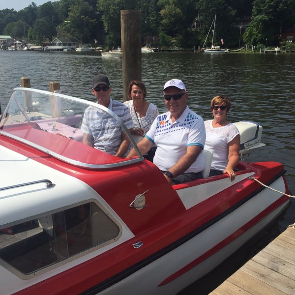 a group of people on a boat in the water