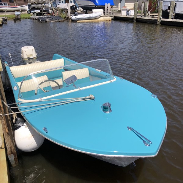 a boat is docked next to a body of water