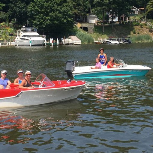 a group of people in a small boat in a body of water