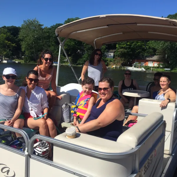 a group of people sitting on a boat